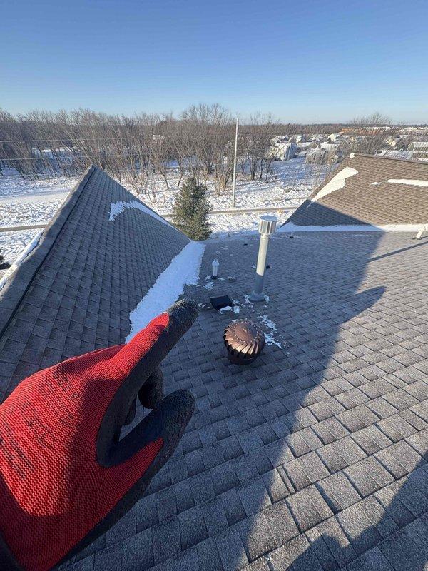 Responded to no heat service call at customer's newly purchased residence. Diagnosed frozen condensate flue pipe on roof, which was causing system shutdown. Accessed roof, thawed blocked vent pipe, and restored proper exhaust flow. Also replaced air filter to improve system efficiency. Customer was educated about common freeze-up issues with this system configuration and preventive measures.