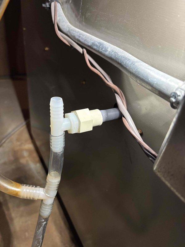 Diagnosed no heat issue in aging HVAC system caused by water accumulation in inducer motor. Removed water to restore functionality and advised homeowner about necessary preventative maintenance to avoid future condensate drainage problems.