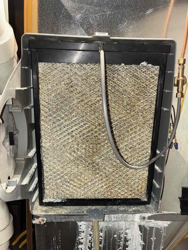 Responded to no heat complaint where system was not reaching second stage operation. Upon inspection, found heavily soiled air filter restricting airflow and causing ice buildup at the filter housing. Replaced filter and verified proper two-stage heating operation, restoring temperature to customer's desired 76°F setpoint.