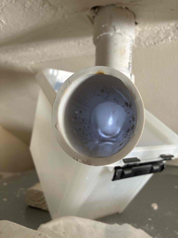 Responded to no heat complaint for chicken coop heating system. Inspected PVC exhaust/intake piping and discovered significant mineral buildup and residue in pipe connections. Cleaned affected components and restored proper airflow, resolving the heating issue.