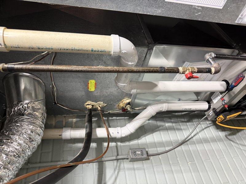 Completed installation of Lennox EL297V 70K furnace with media cabinet replacement. Utilized existing 10x25 return drop and installed 18ft of solid core 2" PVC venting. Confirmed gas line and floor drain were satisfactory, and connected to 15 amp circuit in Crouse Hinds Electrical Panel. Patched hole after removing return grille from return drop.