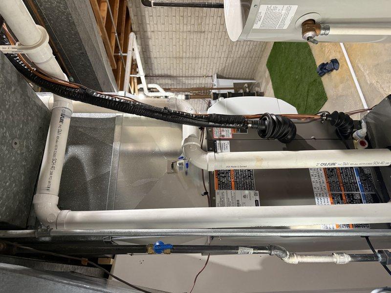 Completed installation of a complete HVAC system including SLP99 70K furnace, EL15KC1 2.5 ton AC unit, 30B-71 cased coil, and S40 thermostat. Replaced 35ft of 2" cellular core PVC and 40ft of refrigeration lines, relocated the existing Aprilaire 700 model humidifier to accommodate the new cased coil, and installed a new 16x25x4 filter in the reused media cabinet. System was properly connected to the Square D QO panel with appropriate circuit protection and successfully connected to customer's WiFi network.