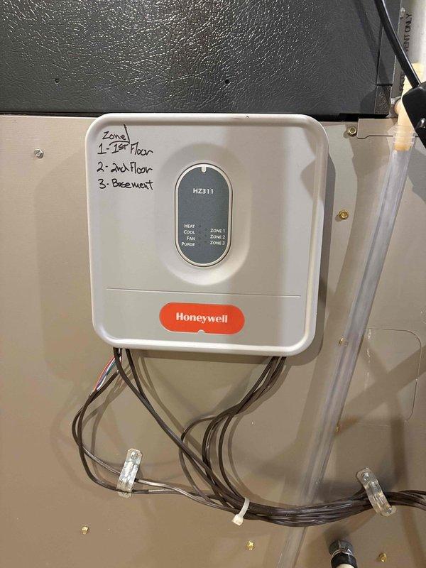 Diagnosed failed blower motor in aging furnace causing no heat condition. Inspected Honeywell HZ311 zone control system which remains functional for zones 1-3 (first floor, second floor, and basement). Provided customer with replacement furnace options due to equipment age exceeding 10 years.