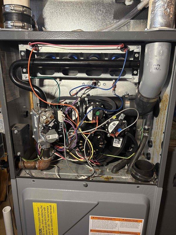 Responded to no-heat call for furnace less than 10 years old. Upon inspection, discovered faulty ignition assembly preventing proper burner operation. Replaced ignition module and verified all connections. System now operating correctly with proper flame sequence and heat output.