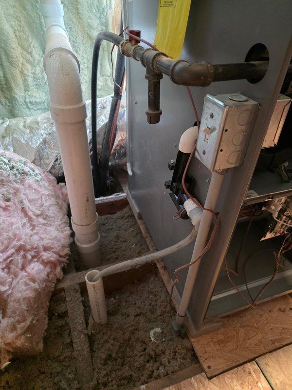 Responded to emergency no-heat call for 10+ year old system with intake blocked by ice due to improper installation by previous contractor. Performed corrective measures by extending flue pipe away from soffits to ensure proper venting and prevent exhaust recirculation. System now functioning correctly with exhaust properly directed away from the structure.