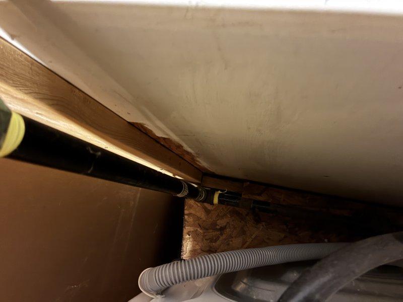 Conducted site visit to obtain measurements for laundry room installation. Inspected existing plumbing connections and utility lines in confined space. Examined stacked washer/dryer configuration and surrounding electrical connections to ensure proper placement and compatibility with current setup.