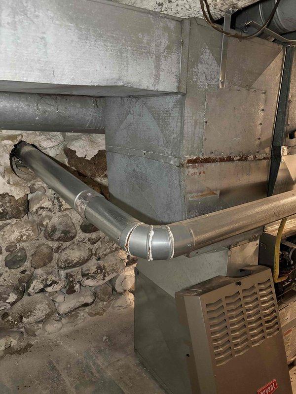 Replaced failed inducer motor on aging furnace unit that showed significant heat exchanger corrosion. Checked gas valve operation per previous service notes and performed comprehensive tune-up. Advised customer of unit's deteriorating condition and provided replacement options due to observed wear and corrosion at critical components.