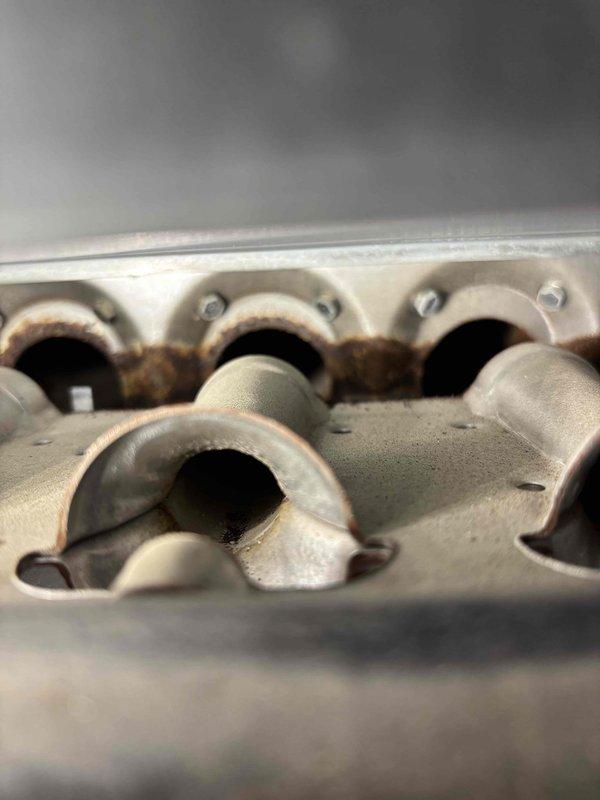 Replaced failed inducer motor on aging furnace unit that showed significant heat exchanger corrosion. Checked gas valve operation per previous service notes and performed comprehensive tune-up. Advised customer of unit's deteriorating condition and provided replacement options due to observed wear and corrosion at critical components.