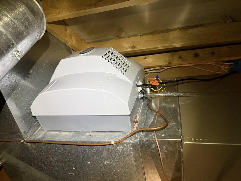Successfully installed an AprilAire 700 whole-house humidifier system on the existing HVAC ductwork. Mounted the unit securely to the metal ductwork in the attic space, connected all required copper water lines, and ensured proper electrical connections. System was tested and is functioning as designed to improve indoor air quality.