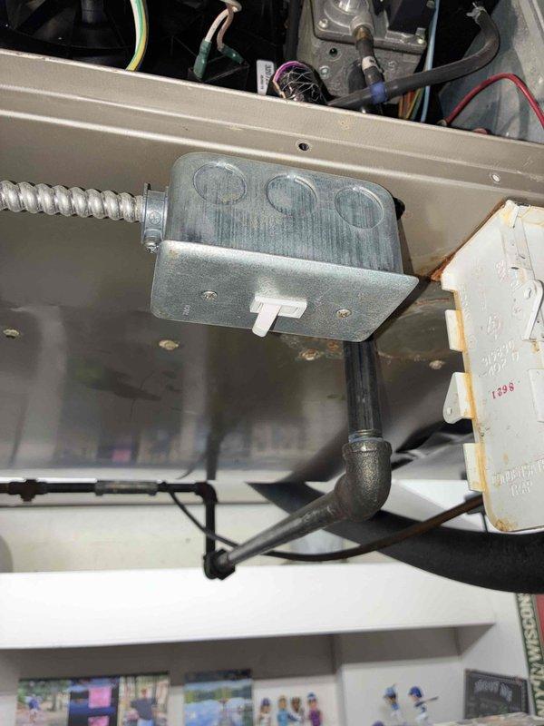 Responded to no heat call after gas meter replacement where one furnace failed to operate. Upon inspection, found corroded electrical connections in junction box and damaged flexible gas line at the furnace connection point. Cleaned electrical terminals, replaced damaged wiring, and properly secured gas line with new clamp to restore proper operation and ensure safe functioning of the system.