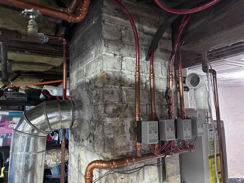 Responded to new customer with non-functional in-floor heating system that had been inoperative for years. Diagnosed multiple issues including significant air entrapment in the distribution system, two faulty zone thermostats, and improper boiler piping configuration. Performed system bleeding to remove air, restored proper system pressure, and documented necessary follow-up work to replace thermostats and reconfigure boiler piping for proper operation.