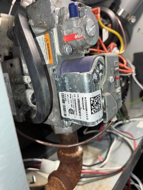 Responded to service call for furnace short cycling. Inspected gas valve assembly showing age-related oxidation and dust accumulation. Examined blower motor, control board, and wiring connections; identified and corrected issue causing the short cycling problem.