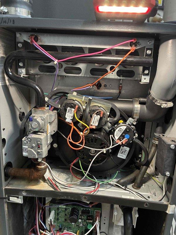 Responded to service call for furnace short cycling. Inspected gas valve assembly showing age-related oxidation and dust accumulation. Examined blower motor, control board, and wiring connections; identified and corrected issue causing the short cycling problem.