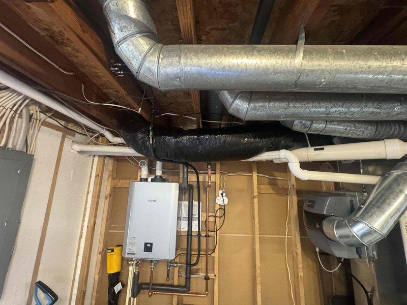 Installed a 6-inch air makeup system in the basement mechanical area, including the mounting of a Broan BD6 pressure relief damper with hood and connection of R-8 insulated flexible ductwork from the damper to the return trunk end cap. System was properly integrated with existing HVAC infrastructure to ensure proper air exchange and ventilation.