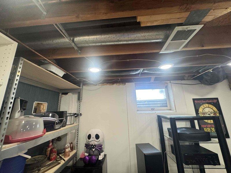 Installed a 6-inch air makeup system in the basement mechanical area, including the mounting of a Broan BD6 pressure relief damper with hood and connection of R-8 insulated flexible ductwork from the damper to the return trunk end cap. System was properly integrated with existing HVAC infrastructure to ensure proper air exchange and ventilation.