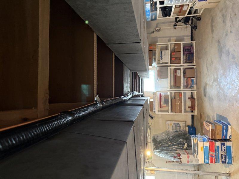 Completed installation of a 3-ton Lennox EL15KC1 air conditioning system in utility area with proper ductwork connections. System was fully installed with insulated refrigerant lines and appropriate mechanical connections to existing infrastructure. Final inspection confirmed proper operation with no outstanding issues.