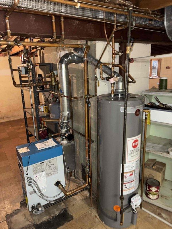 Performed annual maintenance on residential boiler system per prepaid maintenance plan. Inspected all components including copper piping, expansion tanks, valves, and connections throughout the heating system. System appears to be functioning normally with no issues identified during the service visit.