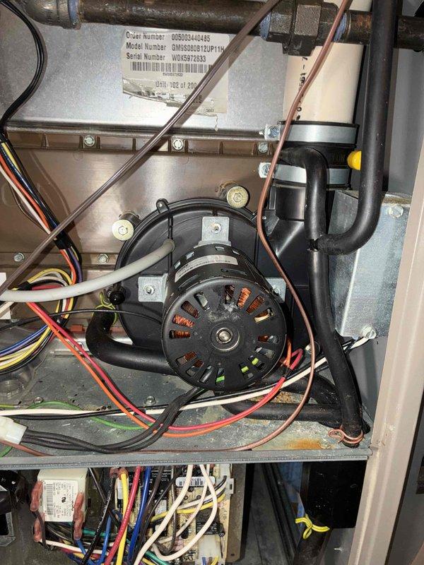 Successfully installed customer-supplied motor in HVAC system, ensuring proper connection of all electrical components (red, white, green, yellow, and black wires) and secure mounting to the metal housing. Inspected ventilation ductwork for proper airflow and confirmed system functionality after installation, with customer signature obtained on invoice per required legal documentation.