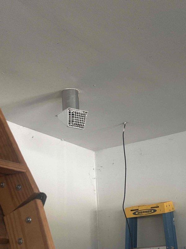 Successfully reconnected customer's bathroom exhaust fan in attic space by routing and securing flexible metal ductwork through existing structural framing. Proper ventilation was restored, resolving the issue previously identified by customer's roofer.