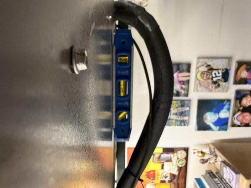 Completed installation of EL297E 90K BTU furnace, ensuring proper leveling of the unit and connection of control wiring to circuit board. Verified all electrical connections were secure and equipment was properly aligned according to manufacturer specifications. Photos were taken to document completed installation for service records.