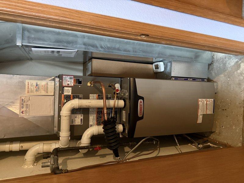 Installed Lennox EL297E 45K furnace and 24B-71 cased coil in preparation for future ML13KC1 1.5 Ton AC installation. Reused existing return drop, 1" filter, gas regulator, 2" PVC, and line set while ensuring proper protection of low voltage wiring along the line set. System was properly connected to existing Cutler Hammer electrical panel with appropriate circuit protection.