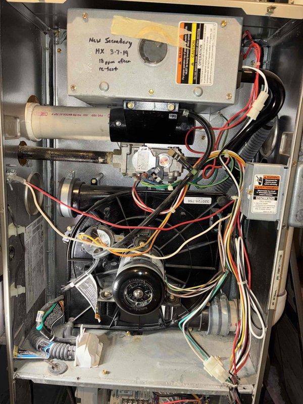 Responded to no heat call and diagnosed flame sensor issue causing 1-3 blink code on furnace control board. Cleaned flame sensor, inspected heat exchanger (previously tagged "HX Secondary" and "HX 3-7-19"), and performed scheduled tune-up service with combustion analysis showing acceptable CO readings.