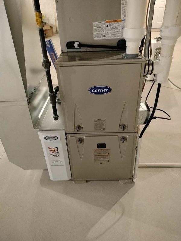 Performed standard tune-up maintenance on customer's Carrier furnace system. Inspected equipment and documented specifications for both furnace and AC units. Confirmed filter (AA #413) was recently replaced by homeowner and in good condition. Completed routine cleaning and operational check with no issues identified.