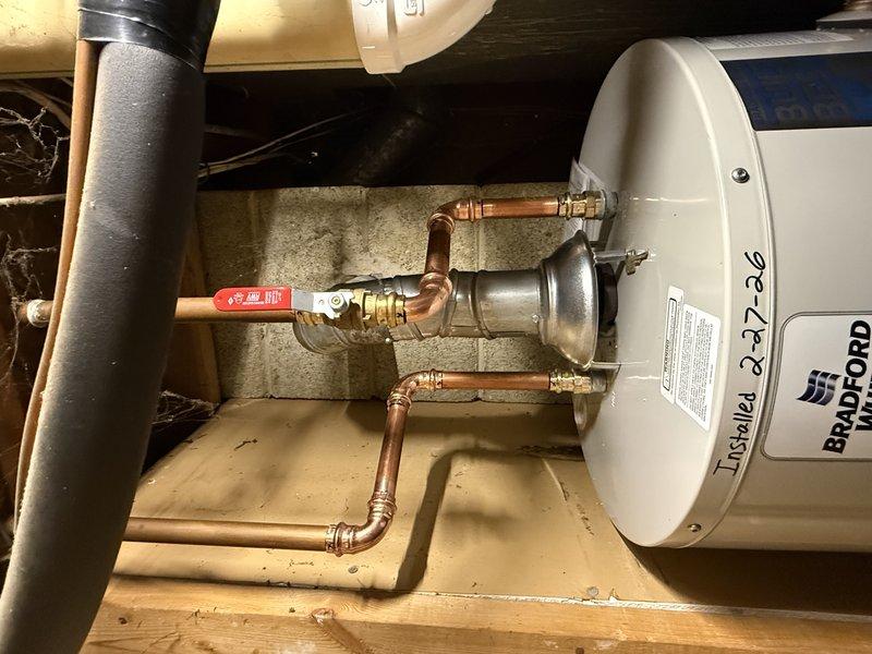 Successfully installed a new 40-gallon Bradford water heater with proper copper pipe connections and shut-off valve. Completed all necessary electrical connections to the control panel, ensuring proper function of the status indicator and temperature controls. Applied extended warranty sticker to unit as required.