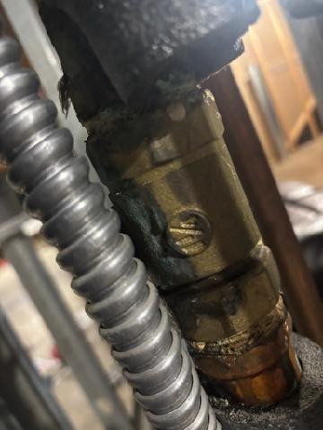 Diagnosed multiple zone failures in 2nd floor boiler system that had been progressively deteriorating over the past two weeks. Identified significant corrosion and leakage at brass ball valve connection point, documented with photographic evidence showing oxidation and moisture damage. Noted customer had attempted to address issues by bleeding zones prior to service call.