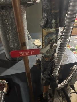 Diagnosed multiple zone failures in 2nd floor boiler system that had been progressively deteriorating over the past two weeks. Identified significant corrosion and leakage at brass ball valve connection point, documented with photographic evidence showing oxidation and moisture damage. Noted customer had attempted to address issues by bleeding zones prior to service call.