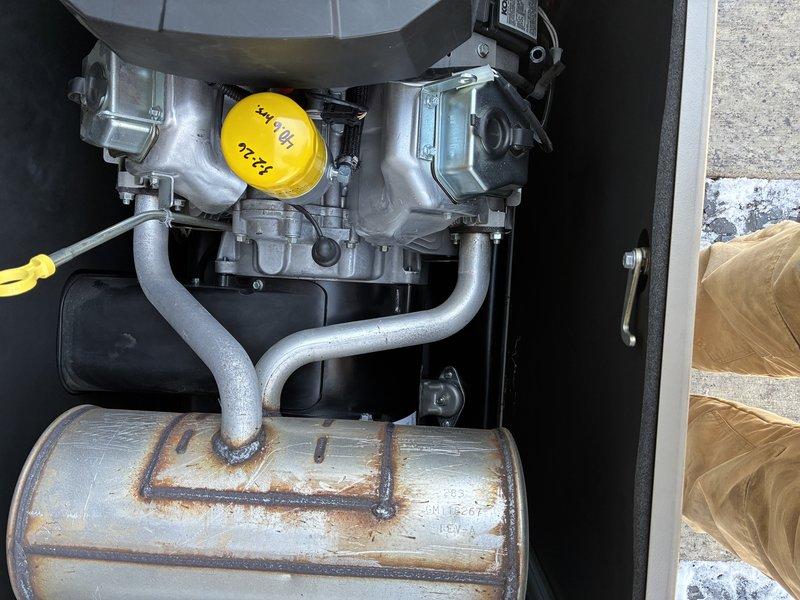 Conducted scheduled preventative maintenance service on a Kohler 26 RCA standby generator system. Inspected internal engine components including fuel lines, connections, and metal reservoir which showed minor weathering at seams. Completed full PM protocol according to manufacturer specifications to ensure operational readiness of the backup power system.