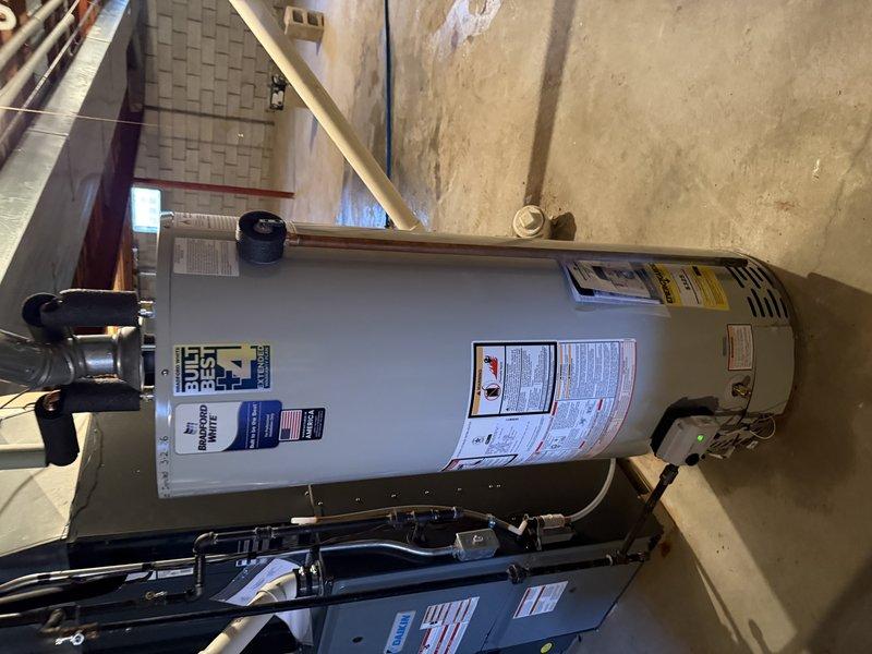 Successfully installed a 50-gallon water heater equipped with an ICON System controller. Completed proper connections to existing plumbing and verified operation. Affixed warranty label to the unit as required.