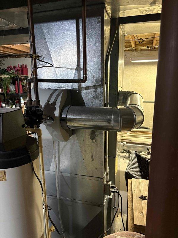 Responded to service call regarding gas odor in basement mechanical room. Upon inspection of Carrier furnace system, no gas leaks were detected. Visual examination of complete HVAC setup including ductwork, venting components, and adjacent water treatment equipment revealed normal operation. Customer was advised that the unusual smell was not gas-related and system is functioning safely.