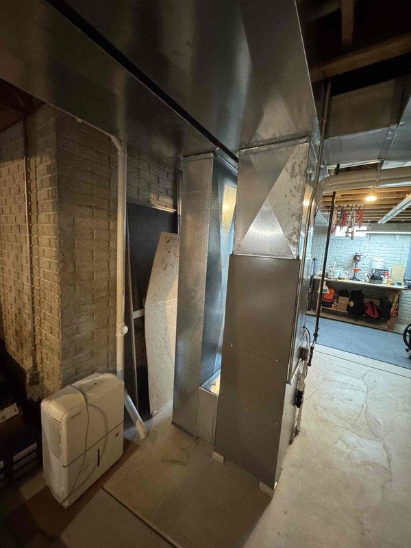 Completed full system installation including EL297V 70K furnace, EL15KC1 3-ton condenser, and 36B-71 coil. Replaced existing media cabinet with new Honeywell unit, reused 24ft of 2" solid core PVC, installed new 30ft refrigerant lines, and repositioned AC unit on new leveled pad with crushed stone support 10-12" from house.