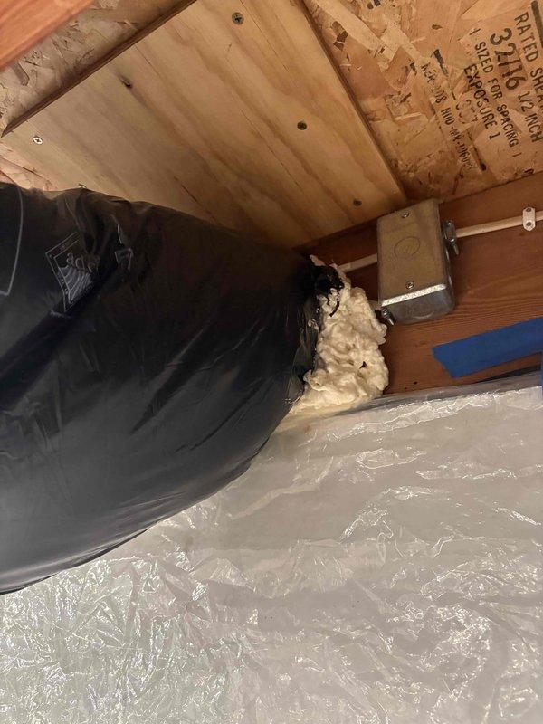 Responded to callback regarding insufficient insulation on make-up air intake connected to furnace return. Inspected metal vent pipe that was exhibiting condensation and allowing cold air infiltration. Applied spray foam insulation around the ductwork junction and sealed gaps between the metal vent pipe and surrounding structure to prevent thermal transfer and condensation issues.