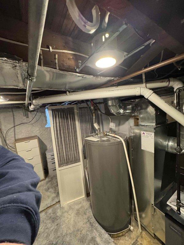 Installed Lennox EL297E 70K furnace with T6 thermostat, replacing existing Coleman unit. Replaced 18ft of 1.5" PVC exhaust/intake piping, modified return drop to accommodate water heater clearance, and installed new media cabinet. Added 4x10 supply register to plenum for downstairs bedroom and replaced cardboard connector in laundry room with proper 12x6 flat 45's and ductwork.
