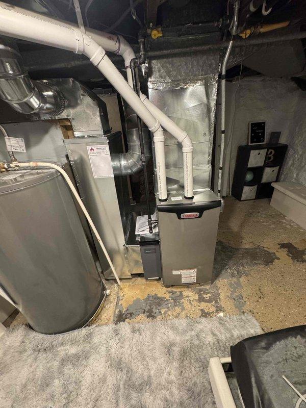 Installed Lennox EL297E 70K furnace with T6 thermostat, replacing existing Coleman unit. Replaced 18ft of 1.5" PVC exhaust/intake piping, modified return drop to accommodate water heater clearance, and installed new media cabinet. Added 4x10 supply register to plenum for downstairs bedroom and replaced cardboard connector in laundry room with proper 12x6 flat 45's and ductwork.