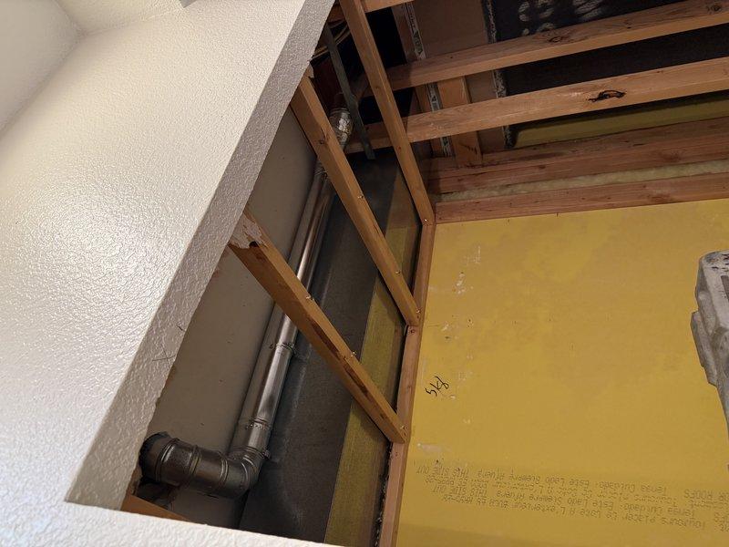 Completed full system installation including Lennox EL297V 45K furnace, EL15KC1 2-ton condensing unit, 24B-71 coil, and T6 thermostat. Reused existing return drop, filter rack, PVC, and line set while correcting drain configuration with proper trap installation off the left side using 3/4" PVC. Additionally, repositioned 3" bathroom exhaust fan ductwork to run closer to the trunk line as requested.