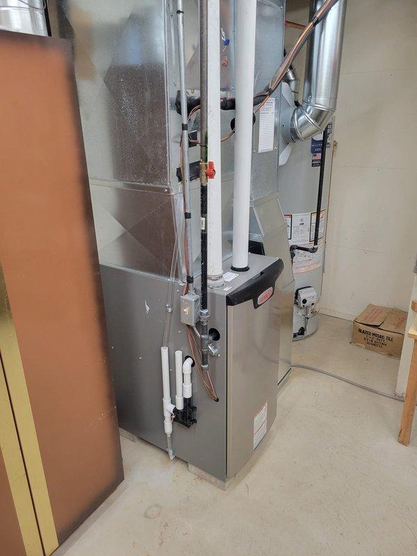 Successfully installed a high-efficiency HVAC system including a Lennox SLP99V 99% AFUE variable speed furnace, S40 Smart Wi-Fi thermostat, and Bradford White 50-gallon water heater. Completed necessary modifications including replacement of 18ft of 2" PVC, media cabinet replacement, return drop modifications, humidifier relocation, and fabrication of new transition between furnace and A-coil.