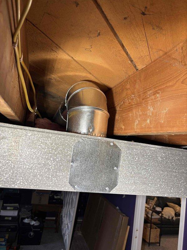 Successfully relocated two 6" round ducts to the top of the trunk line, ensuring both dampers were fully opened for proper airflow. Installed flat patches over old duct openings to maintain system integrity as the trunk line is being prepared for drywall coverage. Completed heat run adjustment to optimize system performance.