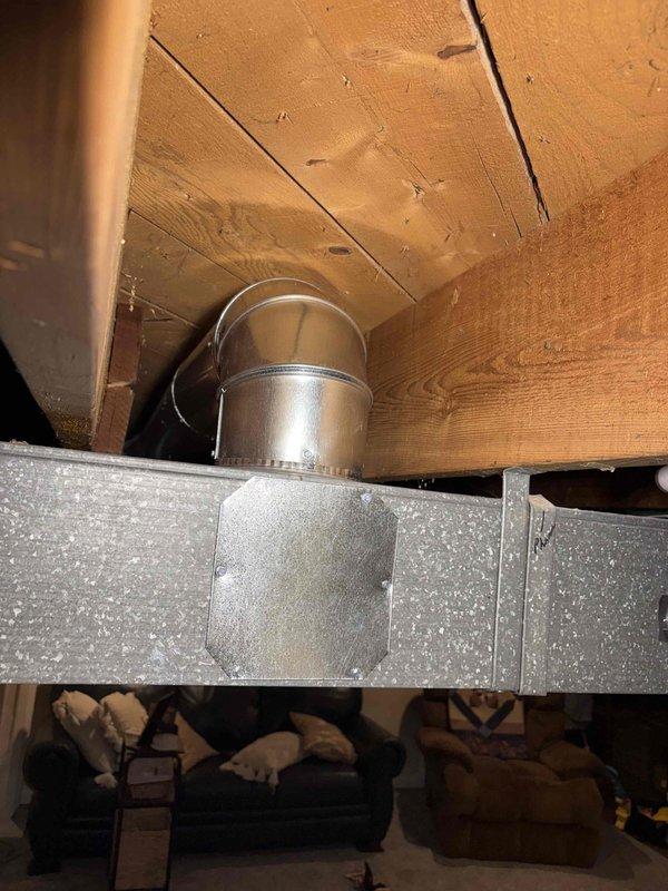 Successfully relocated two 6" round ducts to the top of the trunk line, ensuring both dampers were fully opened for proper airflow. Installed flat patches over old duct openings to maintain system integrity as the trunk line is being prepared for drywall coverage. Completed heat run adjustment to optimize system performance.