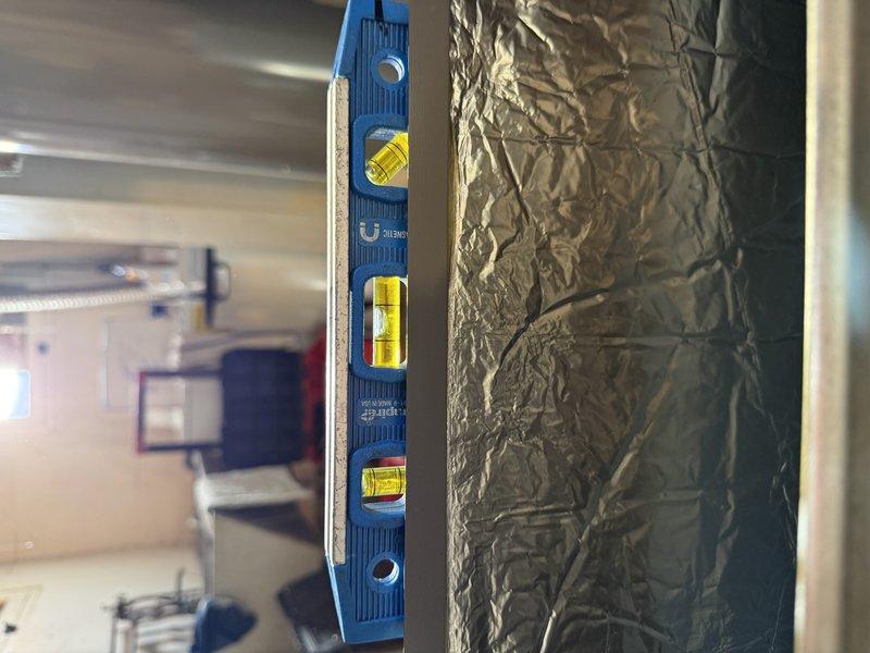 Installed new Lennox EL297E 70K furnace with required 180-degree rotation to meet code compliance. Reconfigured existing 2" PVC venting with proper support and outdoor termination. Replaced return drop, gas valve, and added new media cabinet. Electrical work included reconfiguring BX wiring from ceiling; noted screw-type fuse panel without verified dedicated circuit for furnace. Verified floor drain functionality with installation.