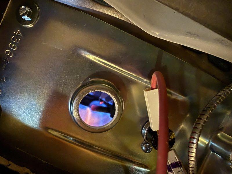 Successfully installed a 50-gallon Bradford White atmospheric natural gas water heater in utility room. Completed all required connections including copper water lines and proper ventilation. Verified proper ignition and flame quality through inspection port.