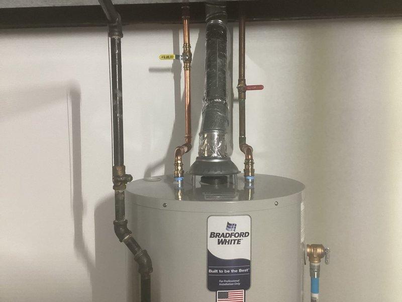 Successfully replaced failed leaking water heater with new Bradford White 40-gallon atmospheric natural gas unit with proper venting and connections. Installation included removal of old unit, connection of copper supply/return lines, gas line hookup, and complete system testing to ensure proper operation.