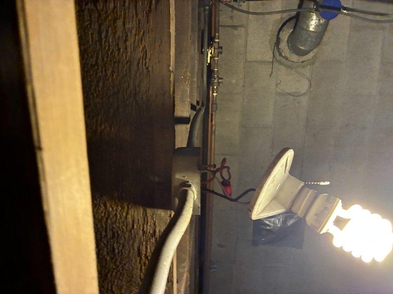 # Service Report: Boiler No-Heat Emergency Call

Responded to no-heat emergency call for residential boiler system. Upon arrival, confirmed complete loss of heating function and proceeded with diagnostic evaluation of the system.

## Diagnostic Findings

Conducted comprehensive inspection of boiler and associated electrical systems. Identified critical issues affecting both high-voltage and low-voltage electrical components serving the heating system. Photographed existing conditions including gas valve assembly, electrical connections, and overall equipment setup for documentation purposes. Set up temporary work lighting to properly assess utility room conditions and equipment accessibility.

## Issues Identified

- High-voltage electrical system deficiencies requiring correction
- Low-voltage control wiring problems affecting boiler operation
- Boiler unit displaying signs of failure requiring replacement consideration
- Gas piping and valve assembly inspected and documented

## Acti