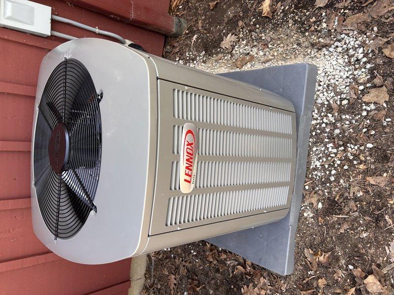 Completed full HVAC system replacement including installation of Lennox SLP99 70,000 BTU furnace, Lennox EL15KC1 2.5-ton air conditioning condenser unit, 30B-71 cased evaporator coil, and S40 programmable thermostat. Outdoor condensing unit was mounted on concrete pad against exterior wall with proper electrical disconnect and conduit installation. System was leveled, secured, and verified for proper operation. All equipment installed per manufacturer specifications and local code requirements.
