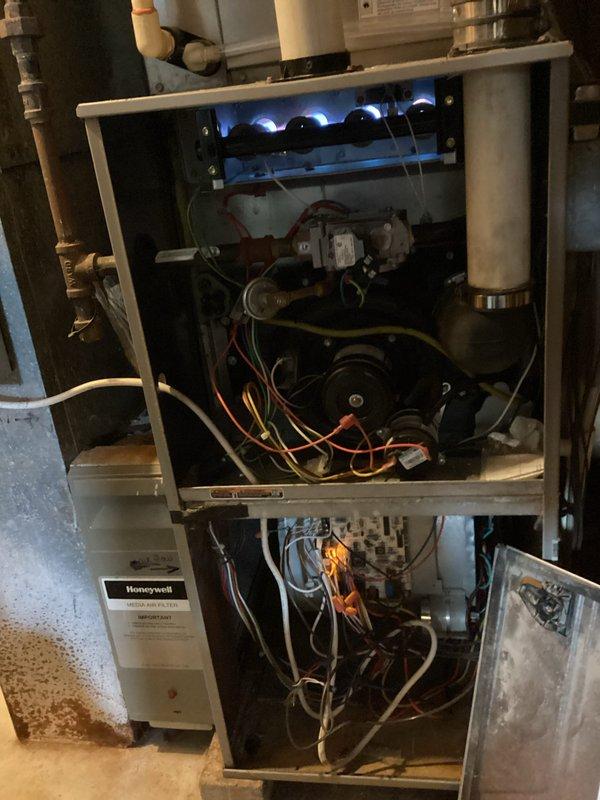 Responded to no heat call and diagnosed faulty thermostat preventing furnace operation. Replaced defective thermostat with new unit and restored heating system functionality. Upon successful repair, completed prepaid maintenance tune-up including inspection of burner assembly, blower motor, electrical connections, gas supply lines, and venting system. Verified proper ignition sequence with blue flame pattern across all burners and confirmed all mechanical and electrical components operating within manufacturer specifications.