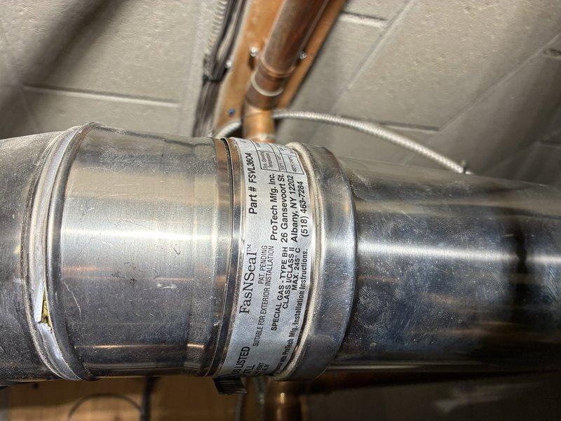 Responded to no heat and no hot water emergency call. Upon inspection, discovered draft motor had seized, preventing boiler operation. Successfully freed and lubricated the seized draft motor, restored boiler functionality, and confirmed hot water production resumed. Prepared comprehensive quote for customer consideration regarding full repair of draft motor assembly versus complete boiler replacement options.