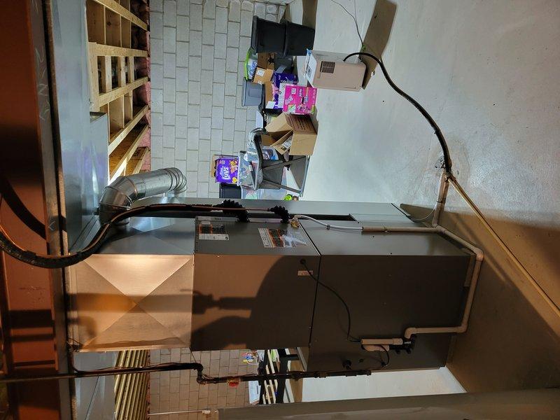 Completed full HVAC system replacement for 2,180 square foot residential property. Installed SLP99 90,000 BTU furnace with 15-amp dedicated circuit, EL15KC1 3-ton air conditioning unit with 30-amp circuit at Cutler Hammer panel, and 36C-71 cased evaporator coil. Installed S40 programmable thermostat for system control. Reused existing 2-inch solid core PVC venting totaling 18 feet in length. Replaced refrigerant line set with new copper lines measuring approximately 15-20 feet to connect outdoor condensing unit to indoor coil. Added new humidifier media cabinet to existing 8x24 return air drop, utilizing 7.5-inch clearance between furnace and ductwork. Verified existing gas valve and condensate drain line were in acceptable working condition and suitable for continued use. Connected electrical circuits to appropriate breakers for furnace and air conditioning operation. System installed to replace aging equipment, tested for proper operation, and left in full working order.