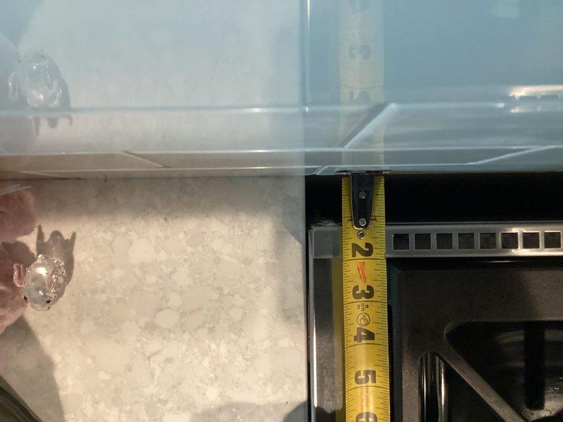 Responded to callback for gas stove regulator humming issue. Upon arrival, utility company had already verified proper meter pressure. Measured gas pressure at stove and confirmed 2 psi, which exceeded appliance specifications. Shut off gas supply, installed step-down regulator on gas line behind stove per utility company recommendation, and restored service. Tested all stove operations to verify proper function and confirmed issue resolved.